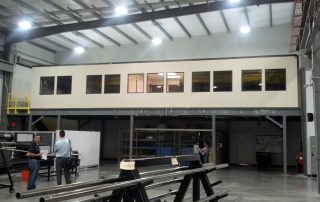Mezzanine Offices Above Manufacturing Mezzanine Offices Above Manufacturing in a warehouse