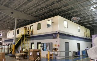 Office Complex on Existing Masonry Structure White Office Complex on Existing Masonry Structure in a warehouse