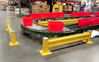 Single Rail Guardrail Single Rail Guardrail near a conveyor belt with red boxes of items