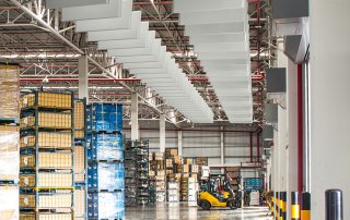 Industrial Hanging Sound Baffles Industrial Hanging Sound Baffles in a warehouse