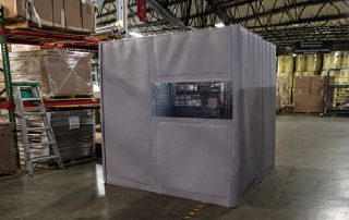 Portable Noise Enclosure Gray Portable Noise Enclosure in a warehouse